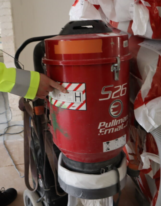Legal regulations demands using H - class vacuum cleaners at site.